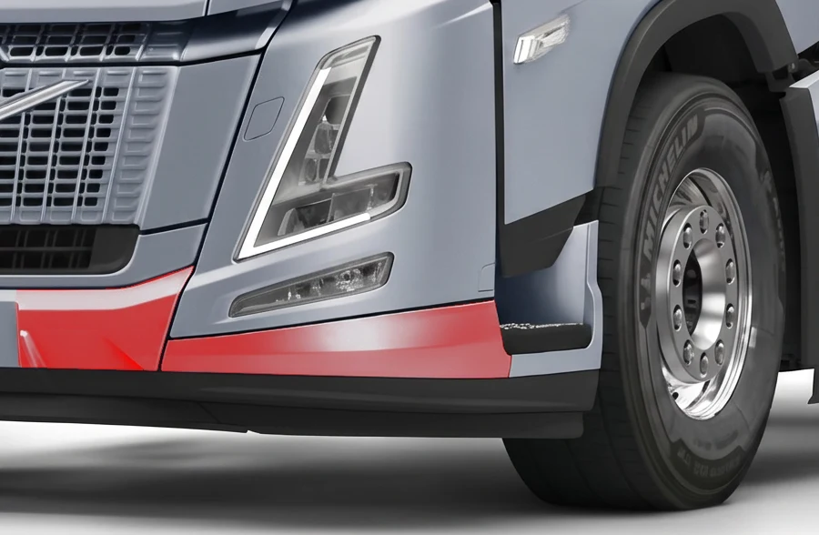 The lower bumper corner on the silver Volvo, highlighted in red.