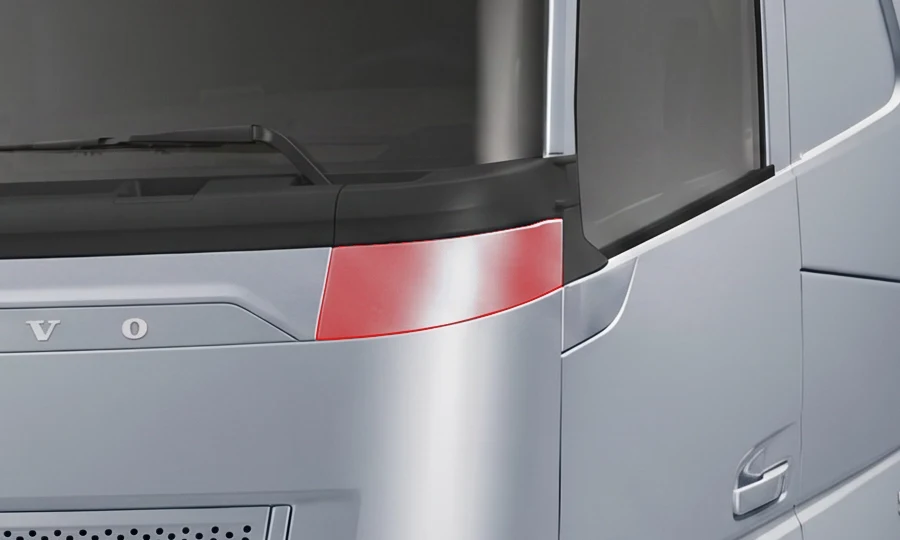 The upper front trim panel on the silver Volvo, highlighted in red.